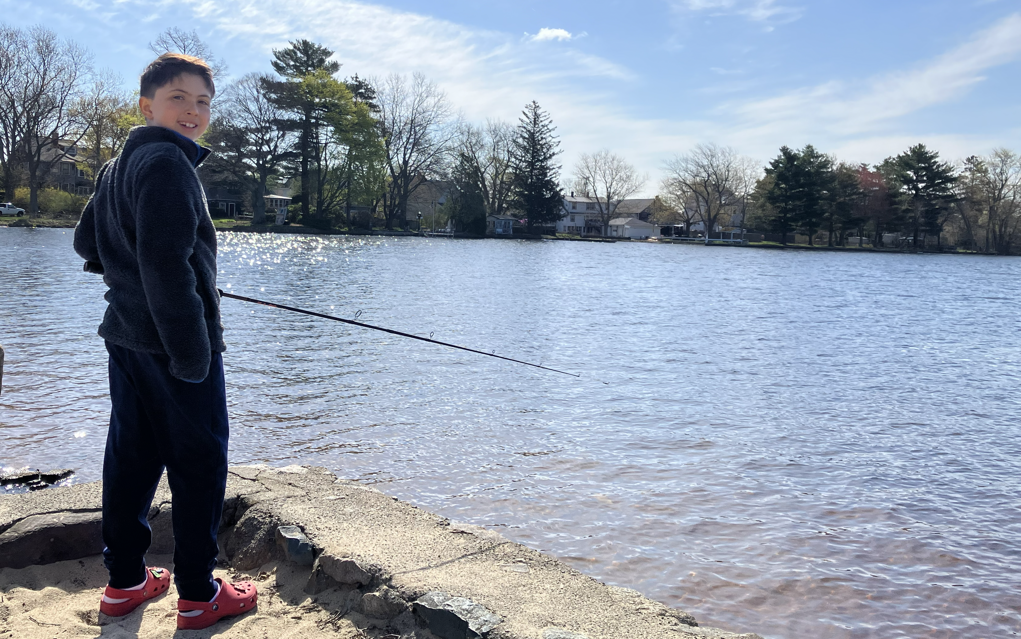 LJ enjoying time outdoors by the water